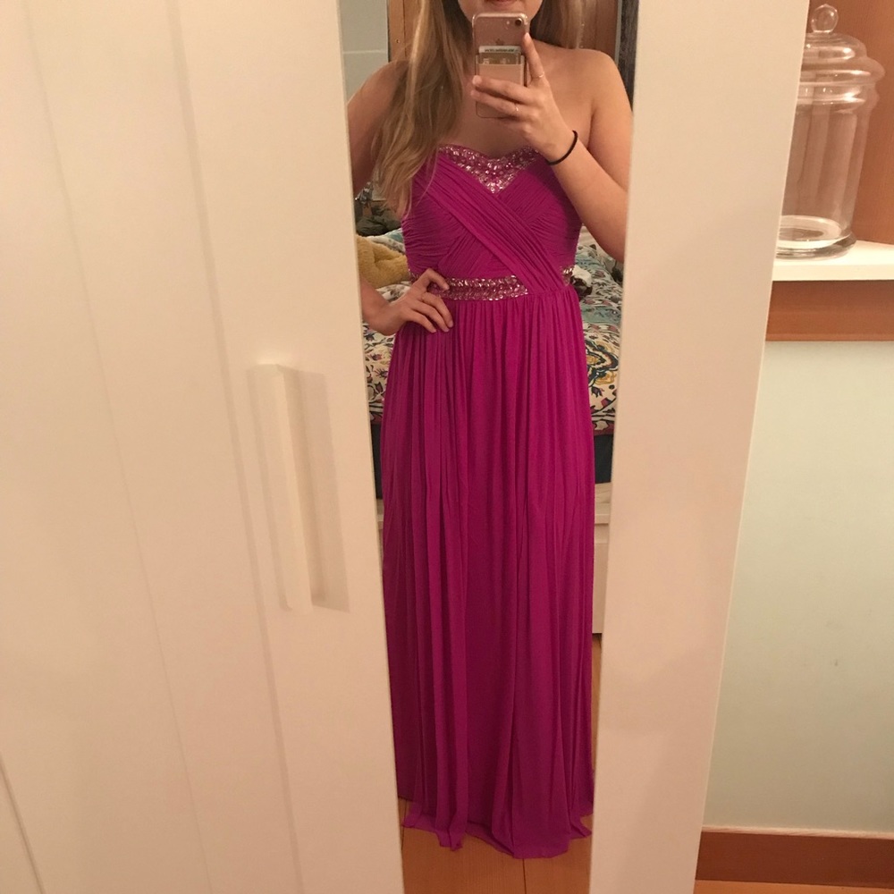 Strapless pink prom dress with beaded bust